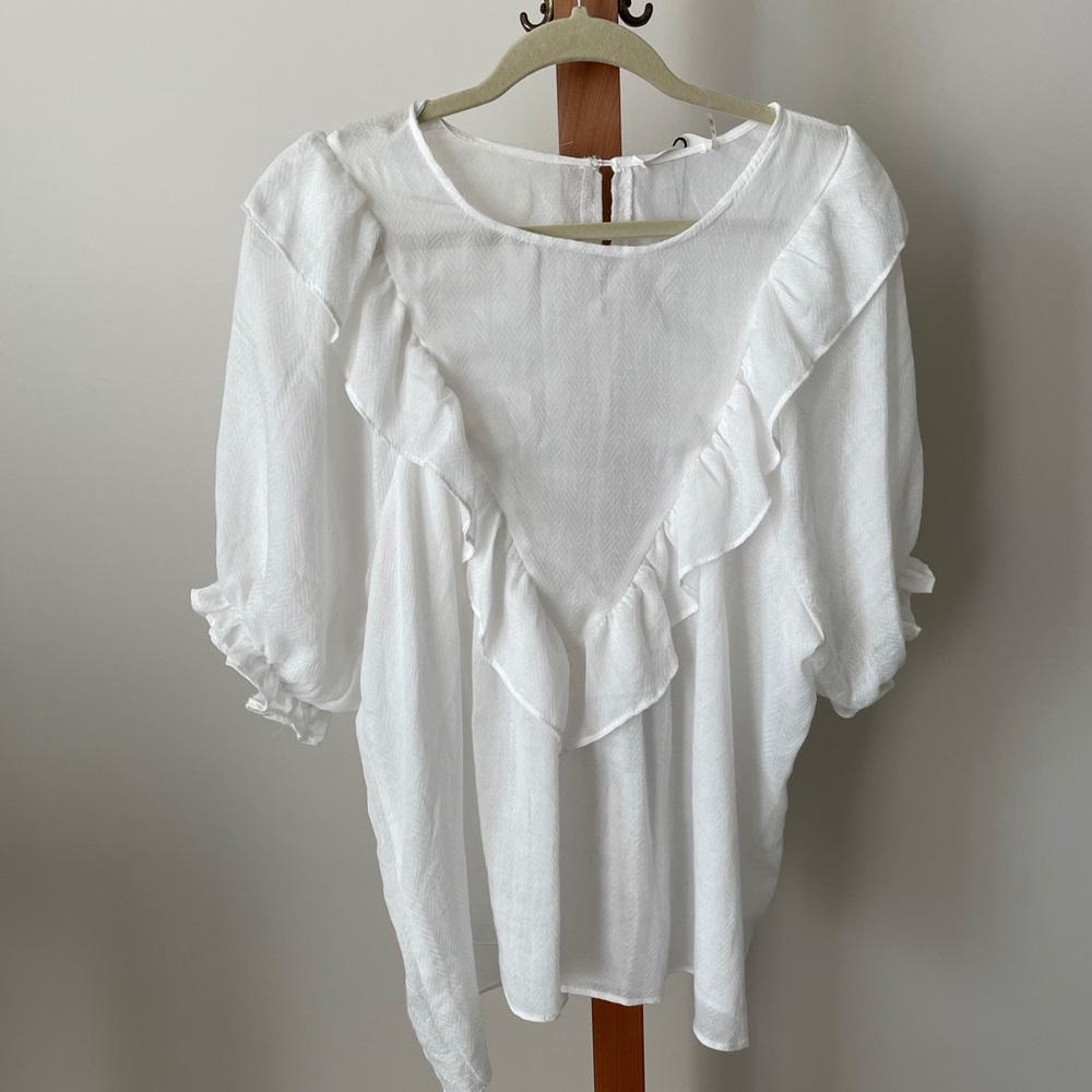 White ruffle blouse